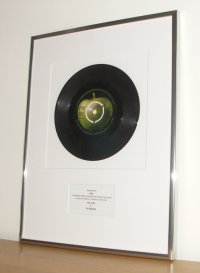 Gift message with framed records and sheet music